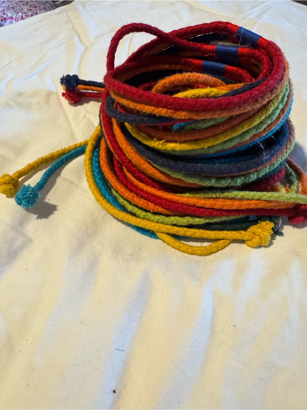 Multi colored strands 87” from end to end.. Vera